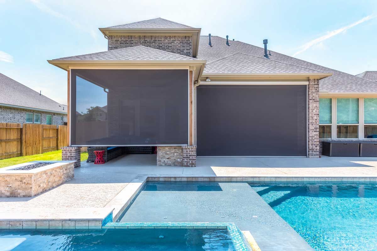 Patio solar shade installed by Jerco beside a pool